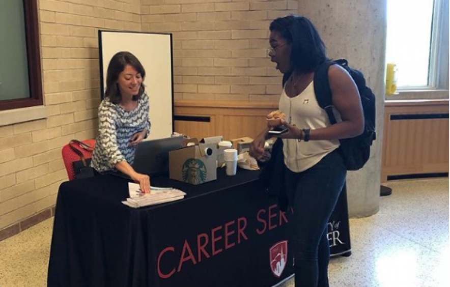 Student meeting Career Services rep