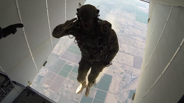 michael kurta jumping out of a plane while saluting