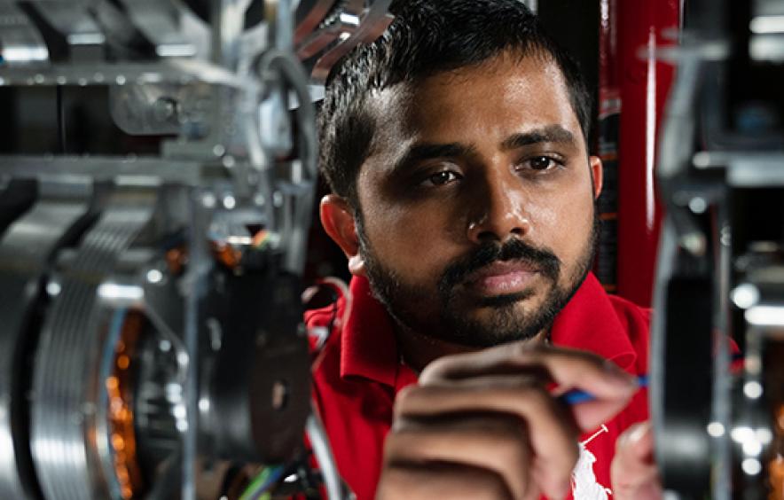 Student working on machine
