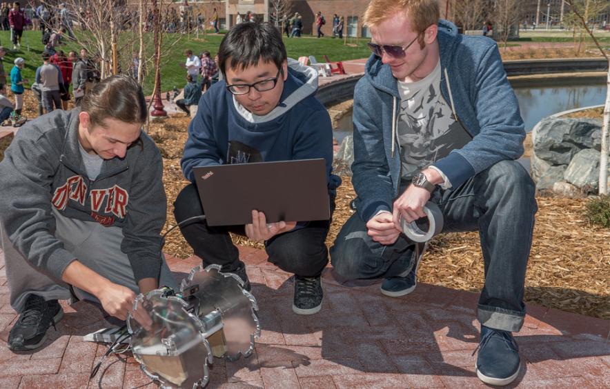 students outside with robot