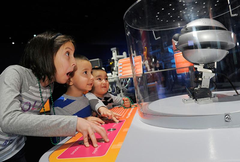 Kids playing with robots