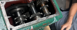 A green gearbox during reassembly