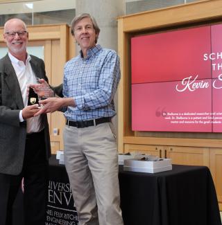 Dr. Shelburne Receiving Scholar of the Year Award from Dean Holston Dr. Shelburne Receiving Award from Dean Holston
